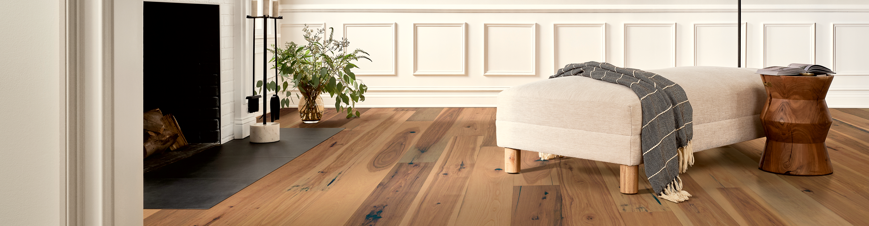medium toned hardwood flooring in living room